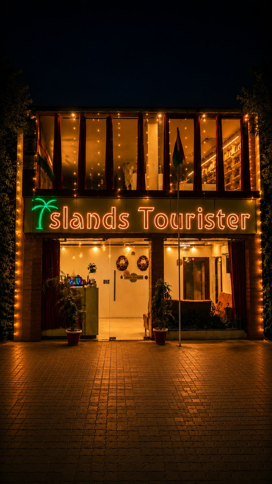 Islands Tourister hotel entrance lit up at night